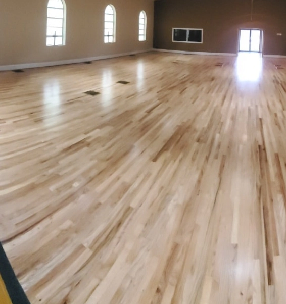 shiny wood flooring matched with brown walls adger al